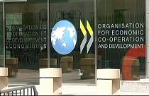 OECD: megszenvedi a világgazdaság a kereskedelmi háborút
