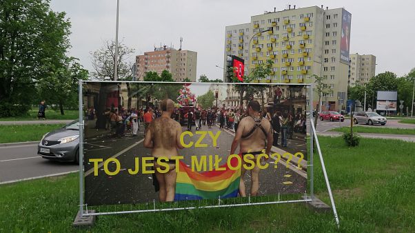 A banner which reads 'Is this love?' is pictured in Swidnik, Poland A banner which reads 'Is this love?' is pictured in Swidnik, Poland