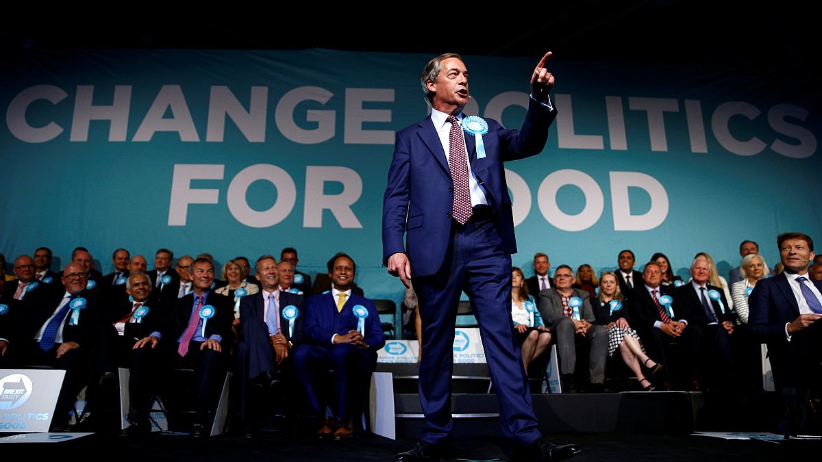 Brexit Party leader Nigel Farage gestures as he speaks in London on 21 May.
