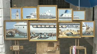 Oil paintings create an image of a giant cruise ship in the city's canal