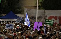 Thousands of Israelis protest legislative changes to grant PM immunity and limit Supreme Court