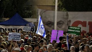 Thousands of Israelis protest legislative changes to grant PM immunity and limit Supreme Court