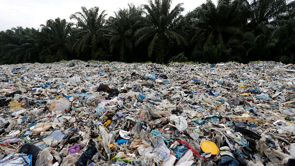 Plastic waste is piled outside an illegal recycling factory in Malaysia