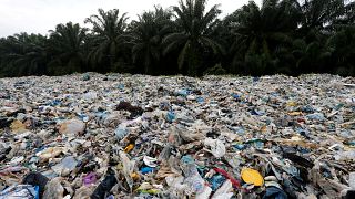 Plastic waste is piled outside an illegal recycling factory in Malaysia