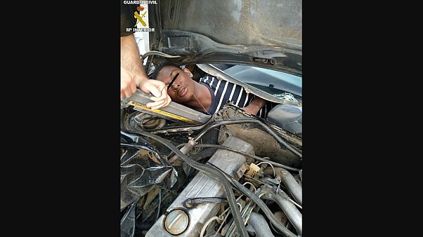 Migrant found hiding in vehicle's glove box by border police Migrant found hiding in vehicle's glove box by border police