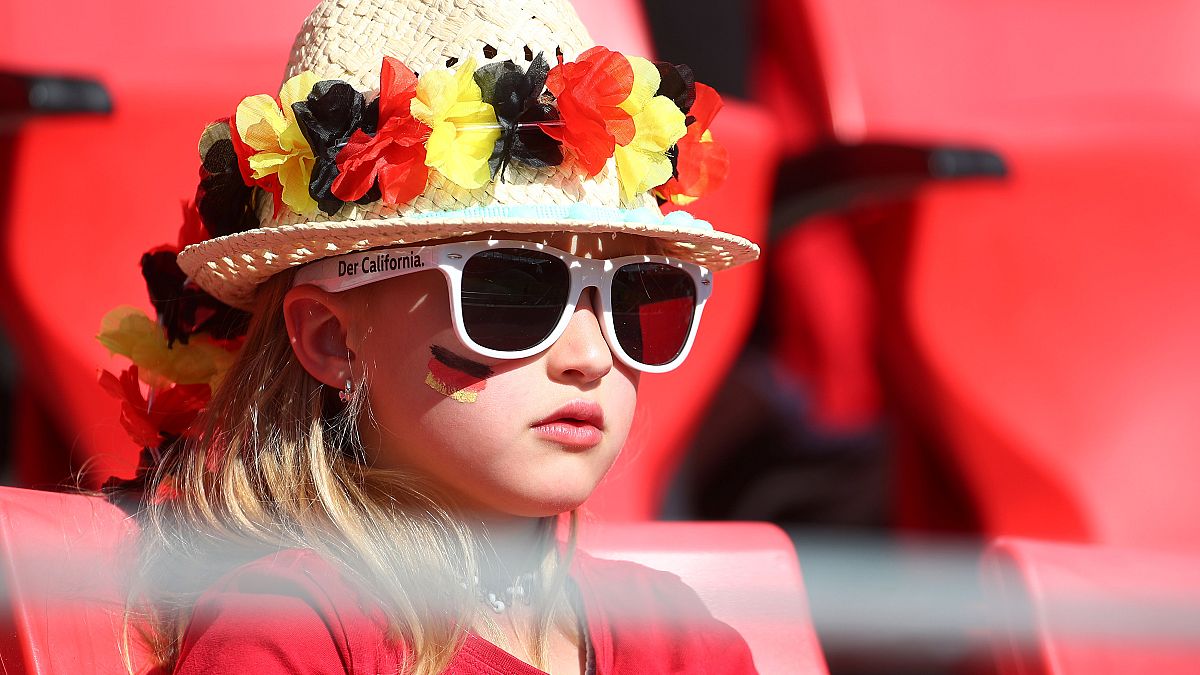 A Germany fan watches the international friendly with Chile this week 