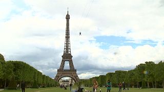 Thrill-seekers take 90 kph zipline ride off Eiffel Tower