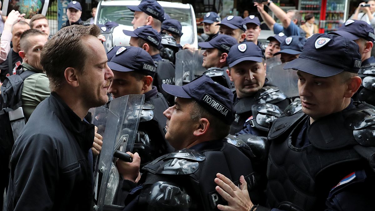 Serb protestors scuffle with riot police in Belgrade
