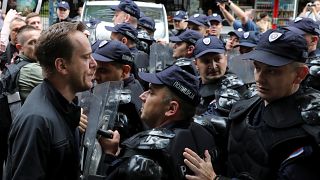 Serb protestors scuffle with riot police in Belgrade