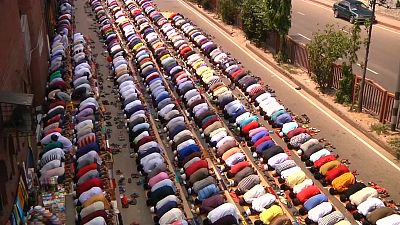Muslim prayers spill over into street on the last Friday of Ramadan