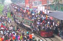 Thousands cram themselves on to trains hoping to make it home for Eid
