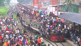 Thousands cram themselves on to trains hoping to make it home for Eid