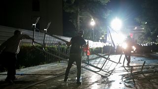 Opposition supporters dismantle barricades outside Parliament building 