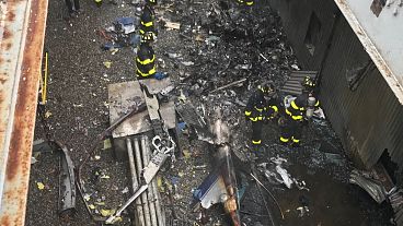 One dead as helicopter crashes into building in midtown Manhattan