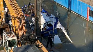 Salvage teams work to raise sunken tourist boat to Danube surface