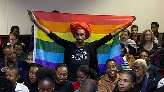  An activist holds up a rainbow flag to celebrate inside Botswana High Court