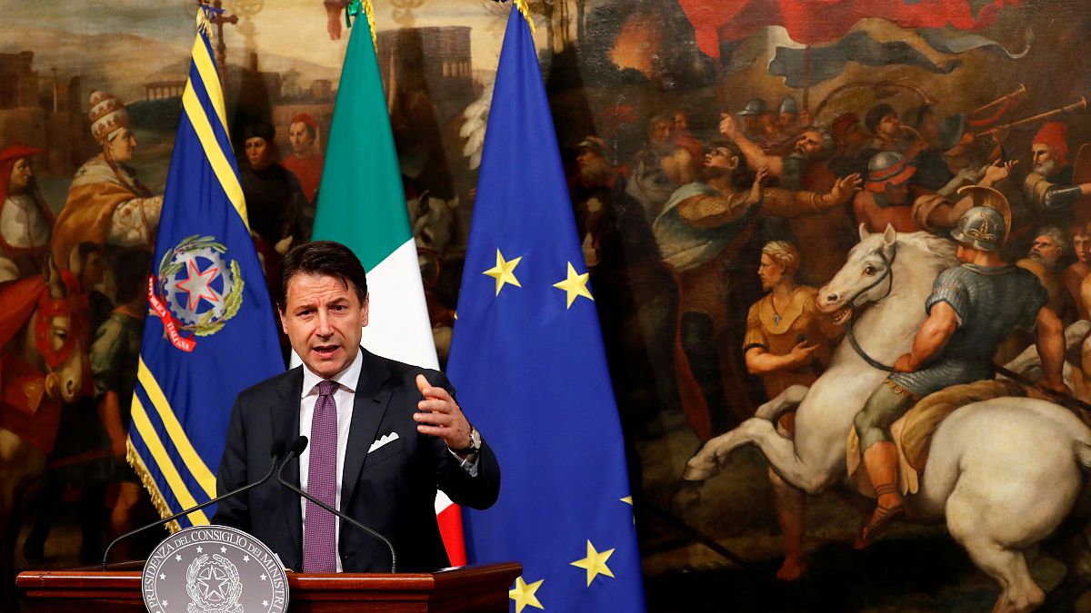 Italian Prime Minister Giuseppe Conte gestures as he holds a news conference at Chigi Palace in Rome