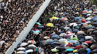 Protesters march along a road demonstrating against a proposed extradition bill in Hong Kong, China June 12, 2019.  