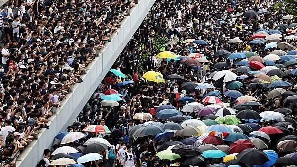 Protesters march along a road demonstrating against a proposed extradition bill in Hong Kong, China June 12, 2019. Protesters march along a road demonstrating against a proposed extradition bill in Hong Kong, China June 12, 2019.