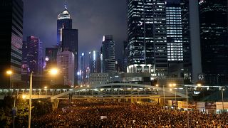Protesters attend a demonstration demanding Hong Kong's leaders to step down