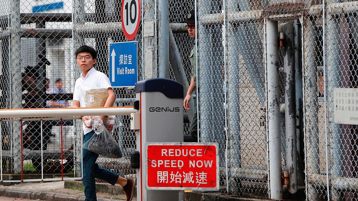 Former student leader Joshua Wong walks out from prison after being jailed for his role in the Occupy Central movement, also known as “Umbrella Movement”