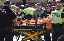 A woman is taken away by ambulance after reports of shots fired in Toronto, Canada June 17, 2019.