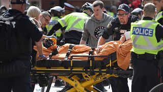 A woman is taken away by ambulance after reports of shots fired in Toronto, Canada June 17, 2019.