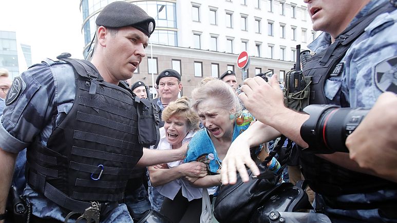 Women react as members of Russia's National Guard detain participants of a rally in support of Russian investigative journalist Ivan Golunov in Moscow Women react as members of Russia's National Guard detain participants of a rally in support of Russian investigative journalist Ivan Golunov in Moscow