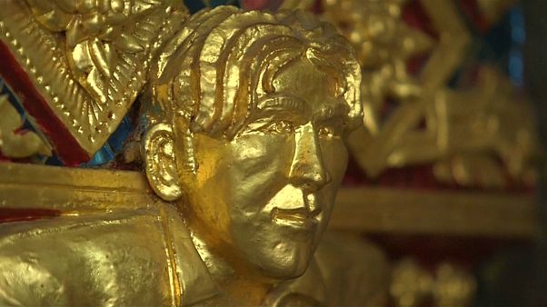 The statue features Beckham's Nineties floppy hairstyle and Man Utd jersey The statue features Beckham's Nineties floppy hairstyle and Man Utd jersey