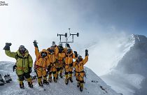 Expedition team celebrates setting up the world's highest operating automated weather station