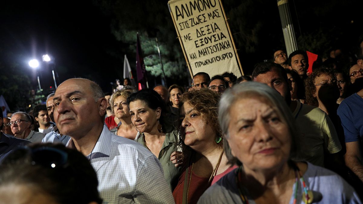 Syriza party supporters listen to a speech of Greek Prime Minister and party leader Alexis Tsipras
