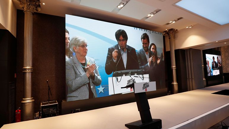 Carles Puigdemont on a television screen Carles Puigdemont on a television screen