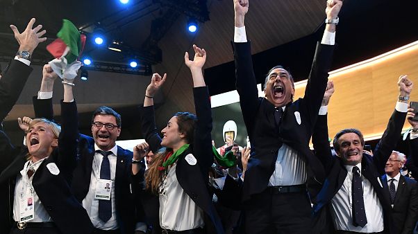 The 2026 Milan-Cortina D'Ampezzo bid team celebrate the Winter Olympic decision. The 2026 Milan-Cortina D'Ampezzo bid team celebrate the Winter Olympic decision.
