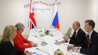 Russia's President Vladimir Putin and Britain's Prime Minister Theresa May attend a meeting on the sidelines of the G20 summit in Osaka, Japan June 28, 2019
