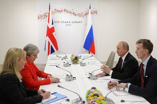 Russia's President Vladimir Putin and Britain's Prime Minister Theresa May attend a meeting on the sidelines of the G20 summit in Osaka, Japan June 28, 2019