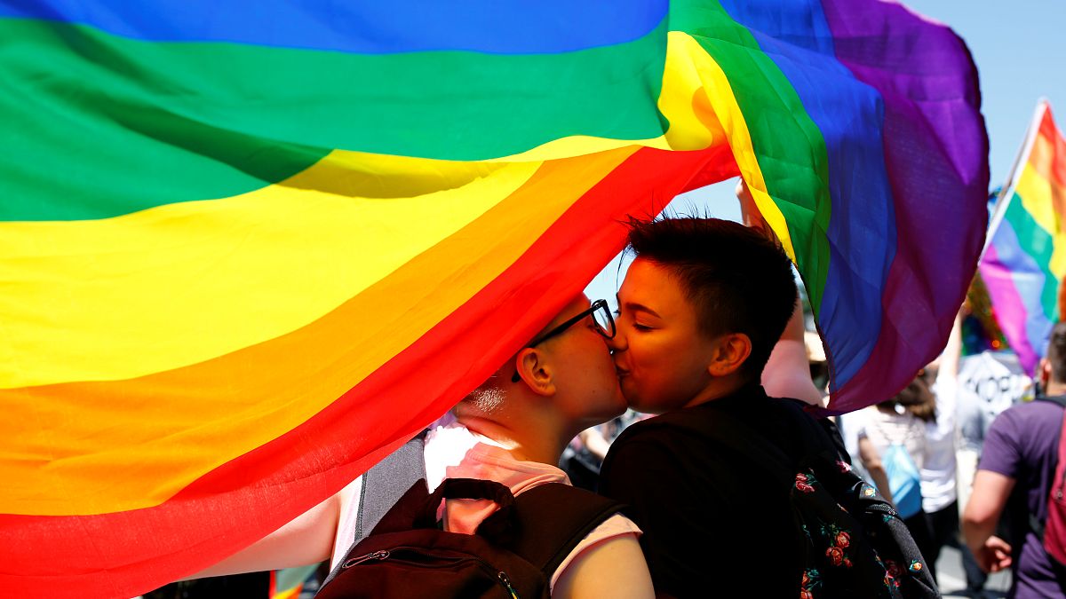 Participants kiss as they take part in the first Gay Pride parade in Skopje.