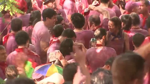 Watch: Crowds at Spain's Haro wine battle throw thousands of litres of the red stuff over each other Watch: Crowds at Spain's Haro wine battle throw thousands of litres of the red stuff over each other