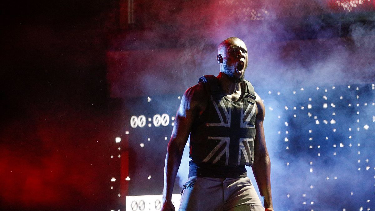 UK rapper Stormzy gives political Glastonbury performance with Banksy-designed stab-proof vest