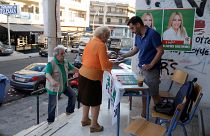 People are seen at a polling station during the general election in Athens, Greece, July 7, 2019. 
