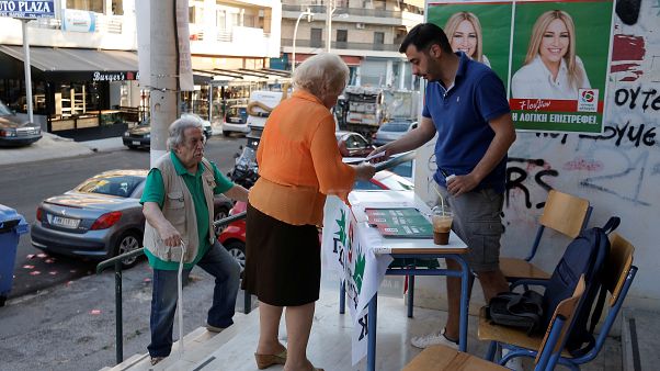 People are seen at a polling station during the general election in Athens, Greece, July 7, 2019. People are seen at a polling station during the general election in Athens, Greece, July 7, 2019.