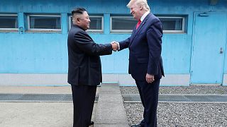 Donald Trump and Kim Jong-Un meet at the DMZ.