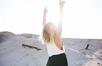 Woman with arms raised