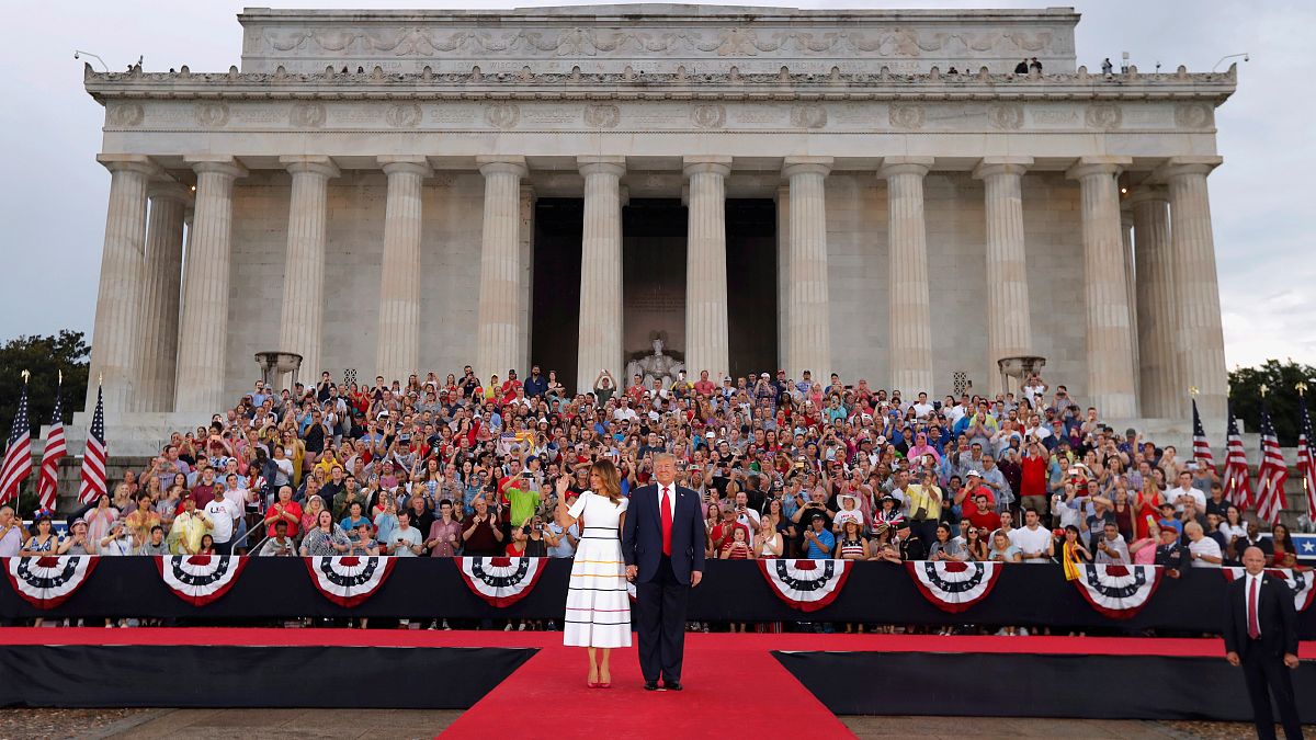 US President Donald Trump greets the crowd with first lady Melania Trump at the "Salute to America" event during Fourth of July Independence Day celebrations 