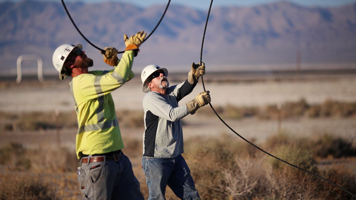 FILE PHOTO: Linemen repair lines that were broken during a powerful earthquake that struck Southern California, July 4, 2019.