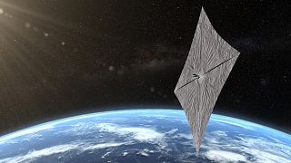 An artist's concept of LightSail 2 above Earth