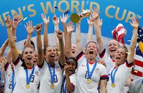July 7, 2019 Megan Rapinoe of the U.S. and team mates celebrate winning the women's world cup with the trophy