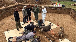 Archaeologists take part in excavation works after they discovered what they believe to be the burial site of French General Charles Etienne Gudin in a park in Smolensk.