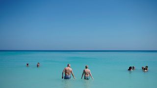 Tourists enjoy the beach in Varadero, Cuba