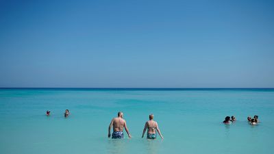 Tourists enjoy the beach in Varadero, Cuba
