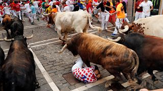 Revellers dice with death in Spain's 'running of the bulls'